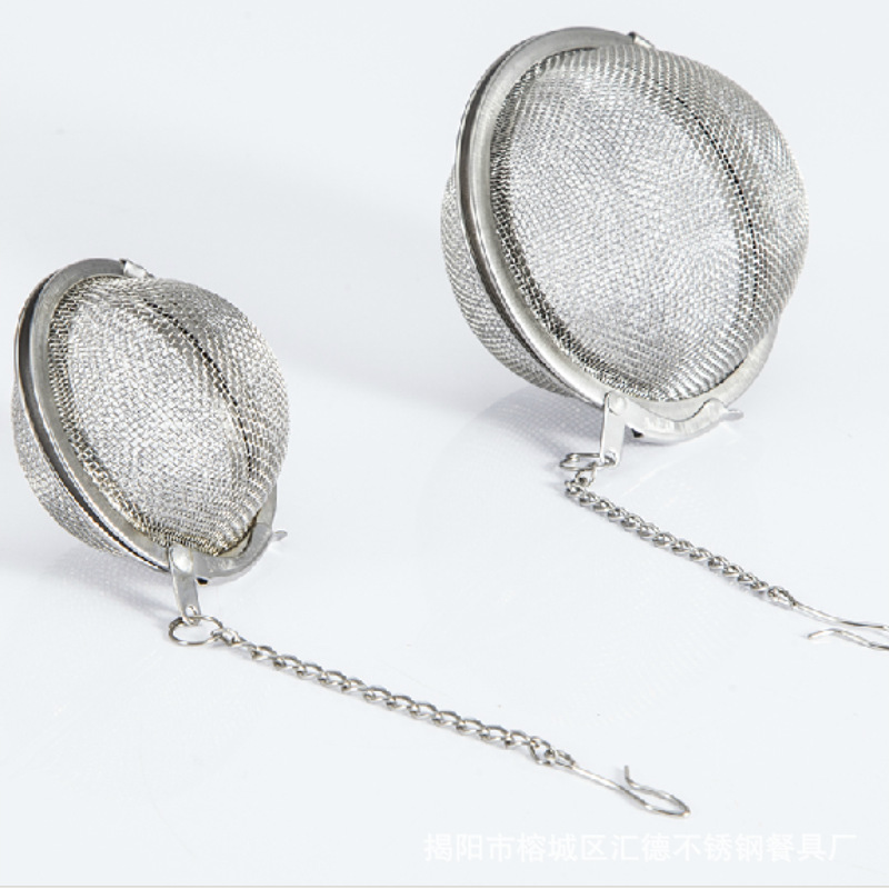 Close-up stainless steel mesh tea balls with chain hooks